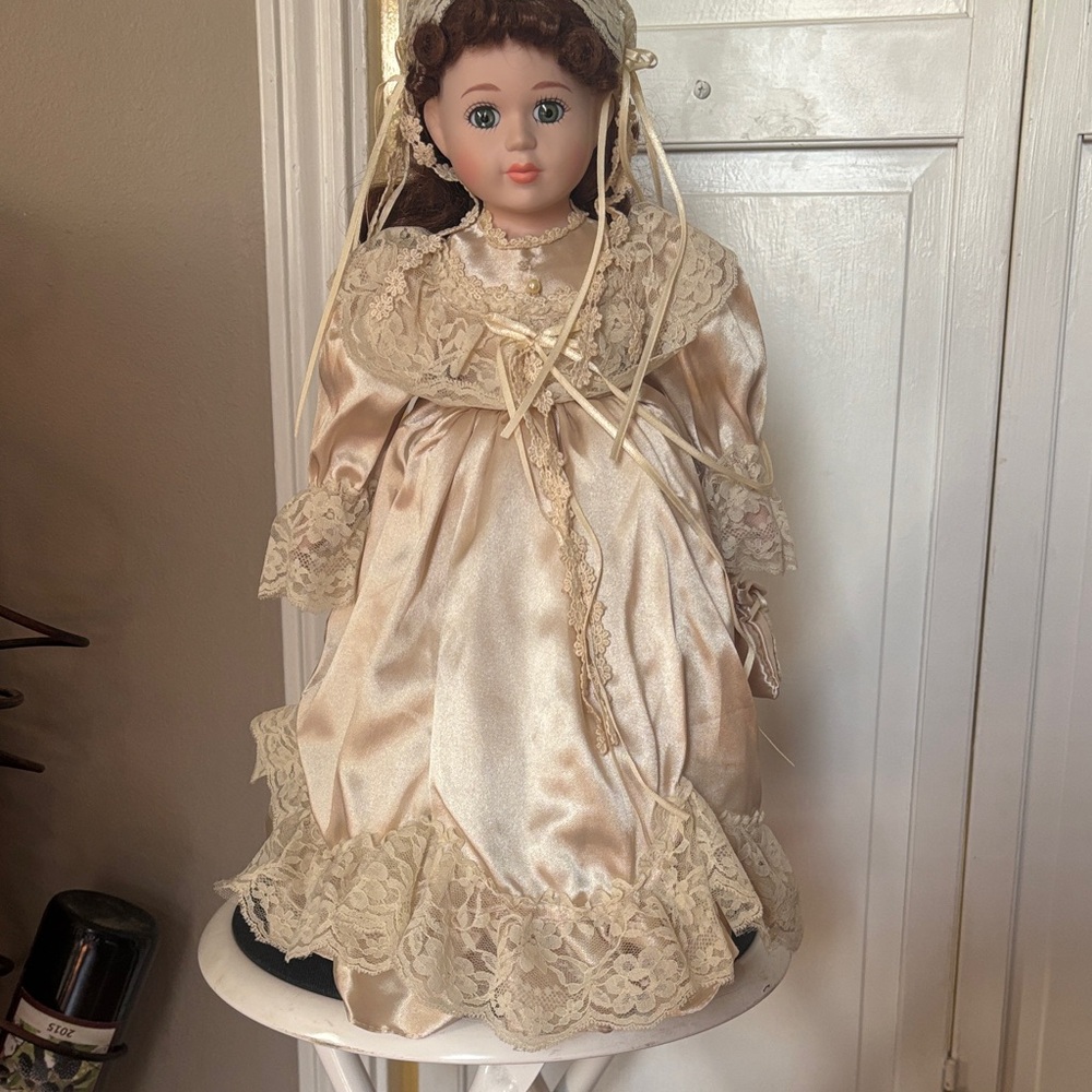 Charming Porcelain Cream Doll with Lace Accents